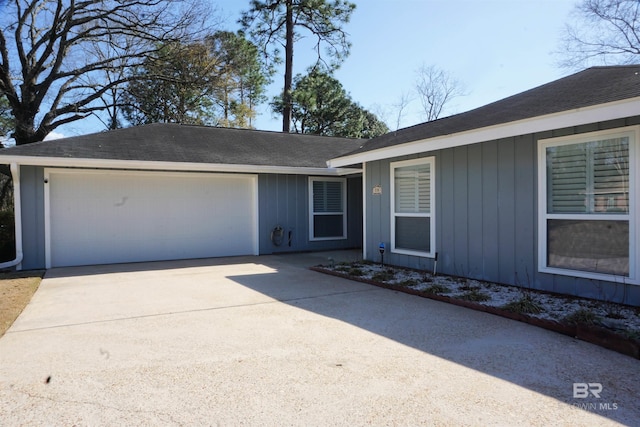 single story home featuring a garage