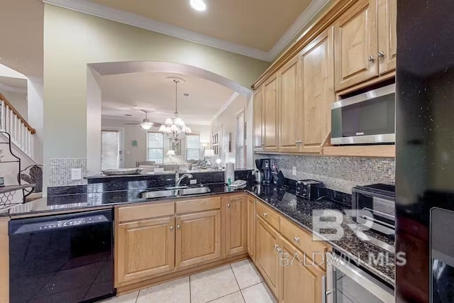 kitchen with crown molding, black appliances, light tile floors, sink, and tasteful backsplash