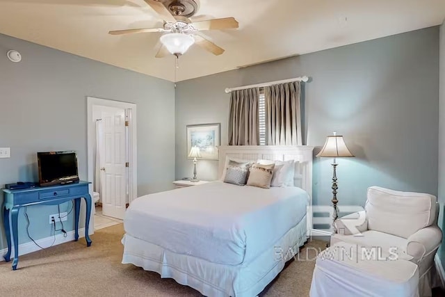 bedroom featuring light colored carpet and ceiling fan