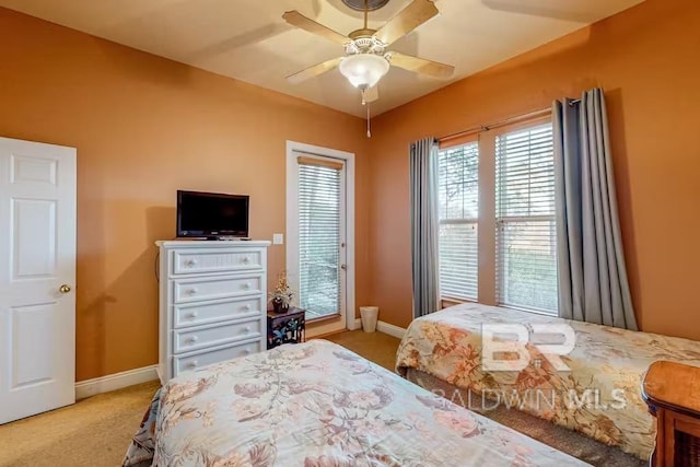 bedroom featuring light colored carpet and ceiling fan