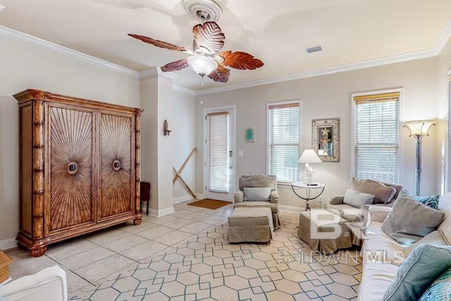 living area with light tile flooring, ceiling fan, and crown molding