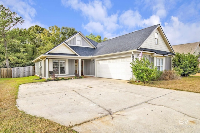 view of front of house with a front yard and a garage