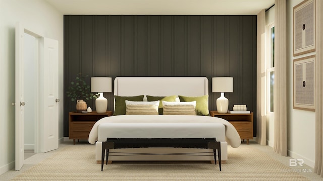 bedroom with light colored carpet and baseboards