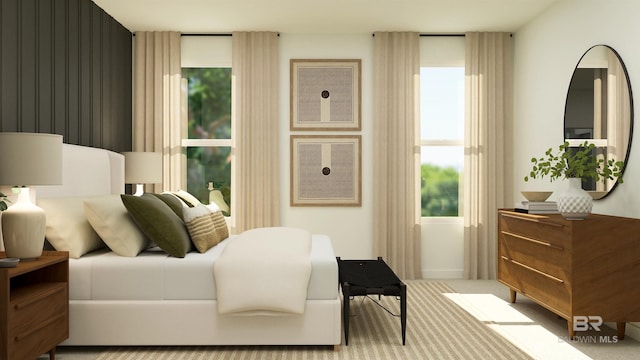bedroom featuring baseboards and carpet
