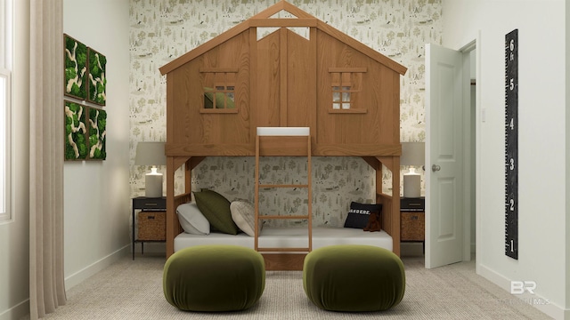 sitting room featuring light colored carpet, baseboards, and wallpapered walls