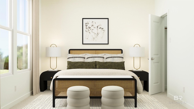 carpeted bedroom featuring baseboards