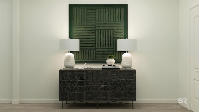 room details with baseboards and wood finished floors