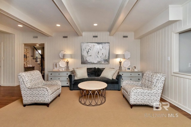 interior space with hardwood / wood-style floors and beamed ceiling