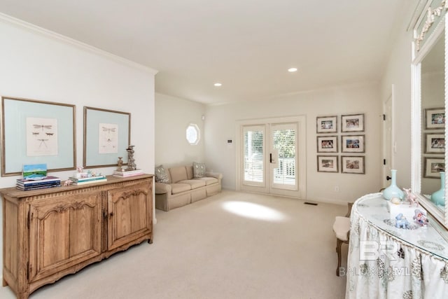 bedroom with access to outside, light carpet, crown molding, and french doors