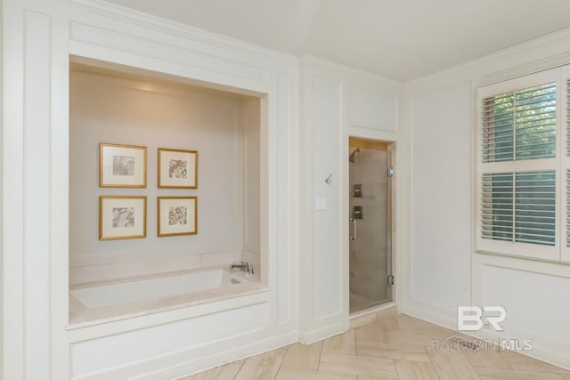 bathroom with crown molding, parquet floors, and shower with separate bathtub