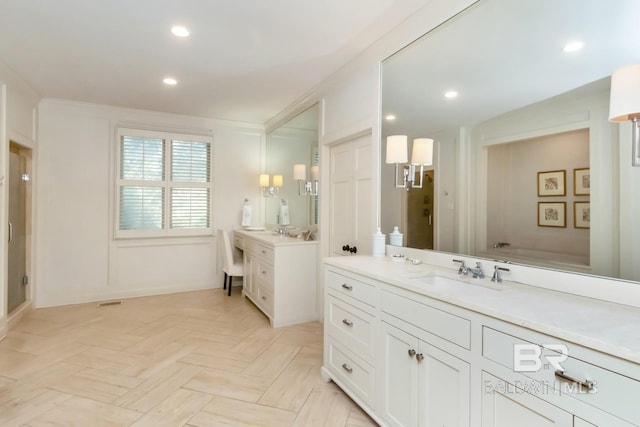 bathroom with parquet flooring, vanity, and crown molding