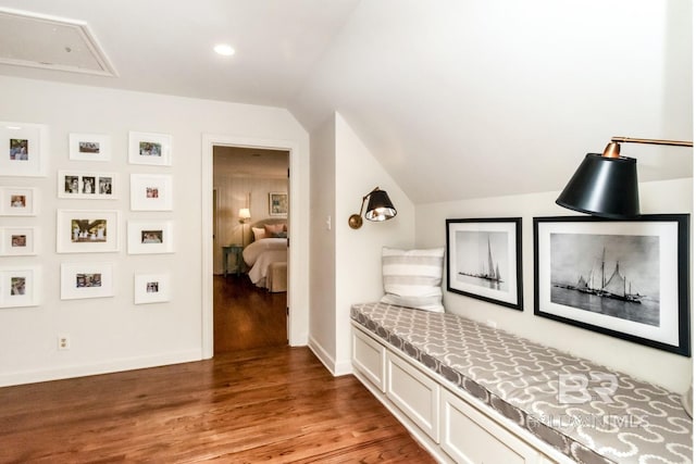 mudroom with hardwood / wood-style floors and vaulted ceiling