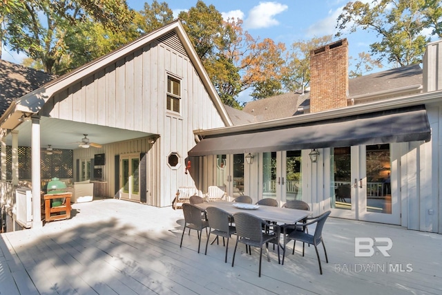 rear view of property featuring ceiling fan, a wooden deck, and french doors