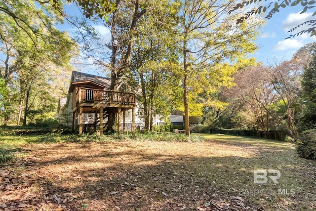 view of yard featuring a wooden deck