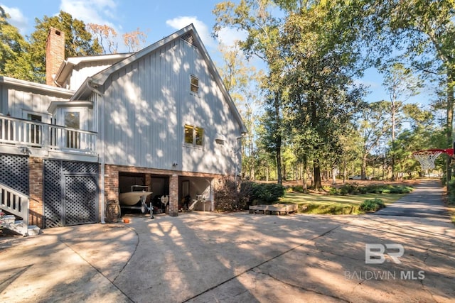 view of home's exterior featuring a carport