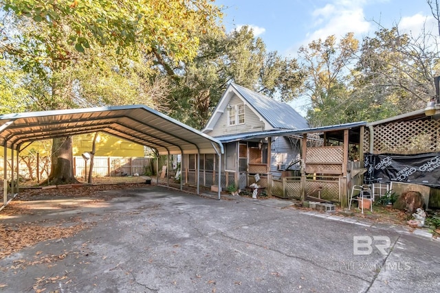 view of vehicle parking featuring a carport