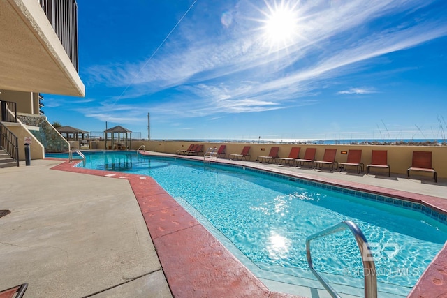 pool with a patio area