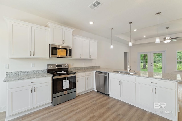 1819 Mary Jane Dr, Bay Minette, AL 36507 - kitchen with a sink, stainless steel appliances, a peninsula, and white cabinetry