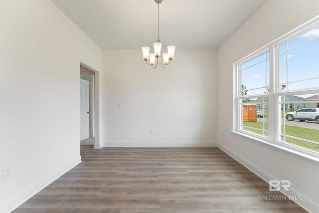 1819 Mary Jane Dr, Bay Minette, AL 36507 - spare room with baseboards, a notable chandelier, and light wood-style floors