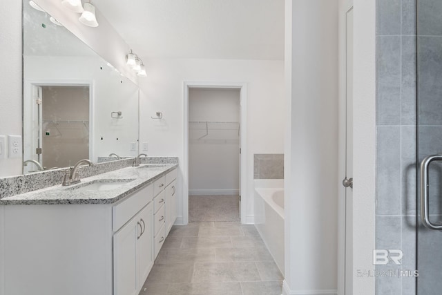 1819 Mary Jane Dr, Bay Minette, AL 36507 - bathroom featuring a sink, double vanity, and a spacious closet