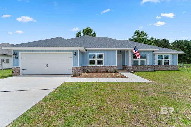 1819 Mary Jane Dr, Bay Minette, AL 36507 - view of front of property featuring a garage, a front yard, driveway, and brick siding