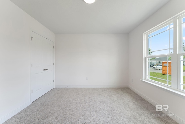 1819 Mary Jane Dr, Bay Minette, AL 36507 - unfurnished room featuring baseboards, carpet, and a healthy amount of sunlight