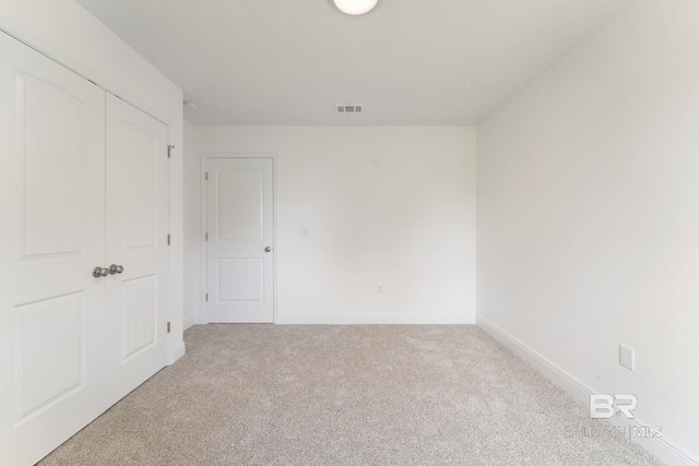 1819 Mary Jane Dr, Bay Minette, AL 36507 - unfurnished bedroom with baseboards, a closet, visible vents, and light carpet