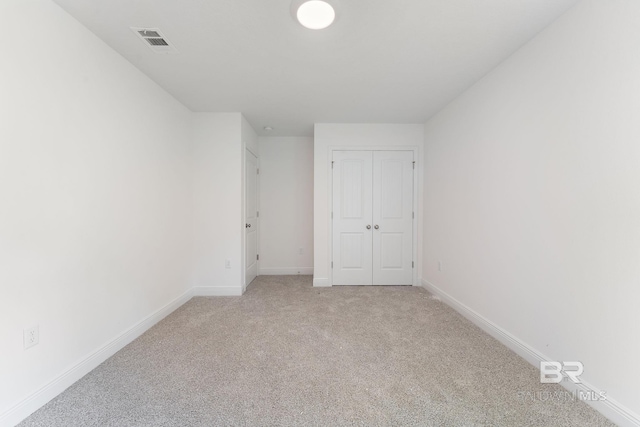 1819 Mary Jane Dr, Bay Minette, AL 36507 - unfurnished bedroom with light colored carpet, baseboards, visible vents, and a closet