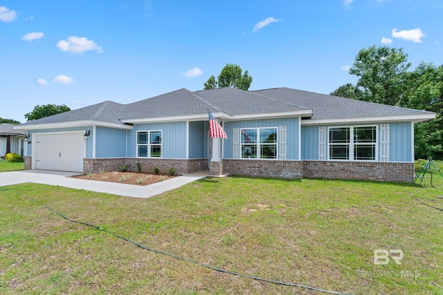 1819 Mary Jane Dr, Bay Minette, AL 36507 - prairie-style house featuring brick siding, a garage, a front lawn, and concrete driveway