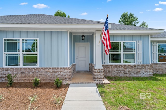1819 Mary Jane Dr, Bay Minette, AL 36507 - entrance to property featuring a lawn, brick siding, and roof with shingles