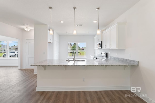 1819 Mary Jane Dr, Bay Minette, AL 36507 - kitchen with visible vents, a sink, white cabinets, a peninsula, and stainless steel appliances