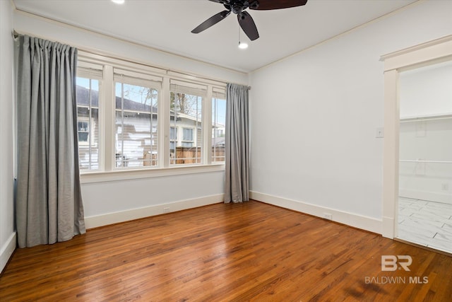 unfurnished bedroom featuring hardwood / wood-style flooring and ceiling fan