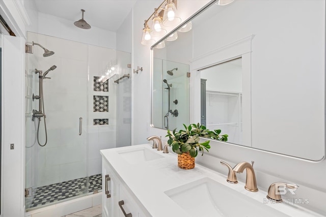 bathroom featuring vanity and a shower with shower door