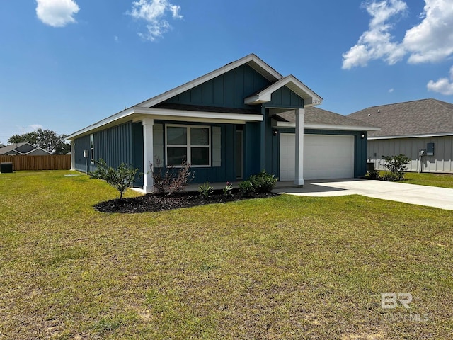 view of front facade featuring board and batten siding, a front lawn, fence, driveway, and an attached garage