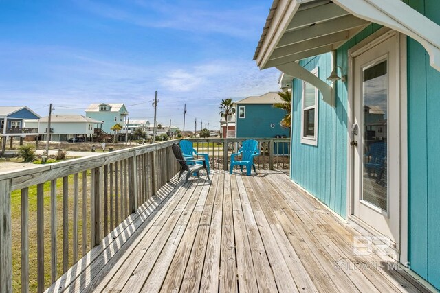 467 W Bernard Ct, Gulf Shores, AL 36542 - wooden deck featuring a residential view
