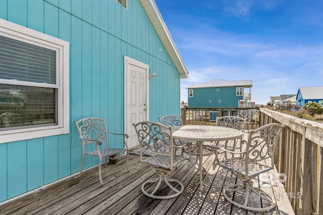 467 W Bernard Ct, Gulf Shores, AL 36542 - wooden deck with outdoor dining space