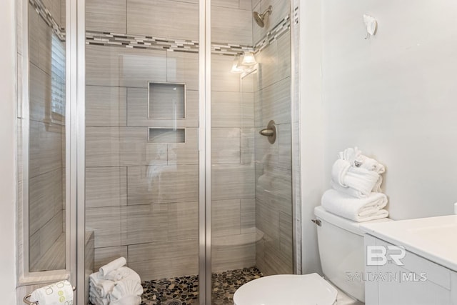 467 W Bernard Ct, Gulf Shores, AL 36542 - full bath with a stall shower, toilet, and vanity