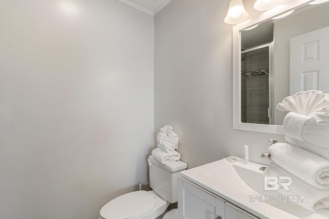 467 W Bernard Ct, Gulf Shores, AL 36542 - bathroom featuring crown molding, toilet, vanity, and a shower