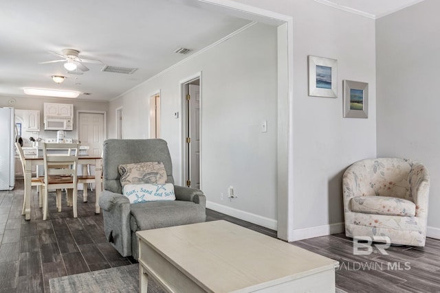 467 W Bernard Ct, Gulf Shores, AL 36542 - living area featuring ceiling fan, dark wood finished floors, ornamental molding, and baseboards