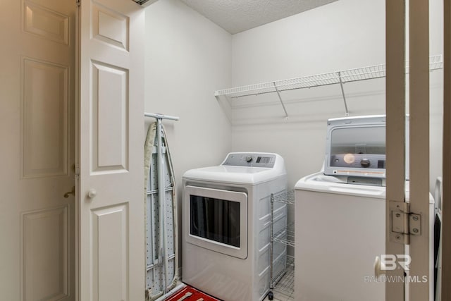 washroom featuring washer and clothes dryer