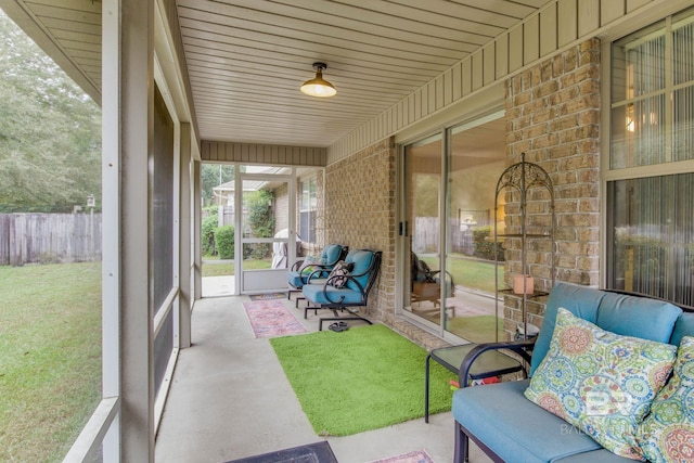 sunroom featuring wooden ceiling