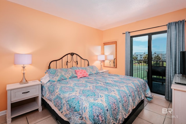 tiled bedroom with access to outside