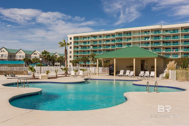 view of swimming pool featuring a patio area and a gazebo