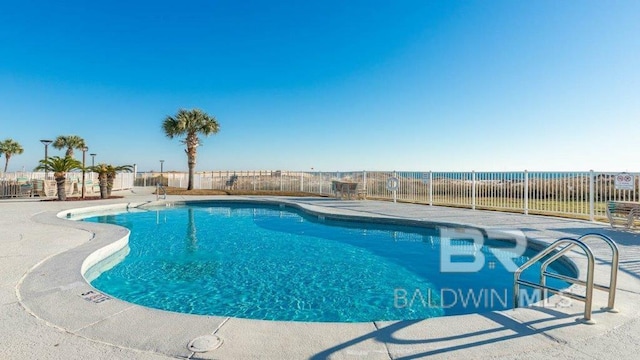 view of swimming pool featuring a patio area