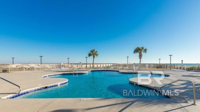 view of pool featuring a patio