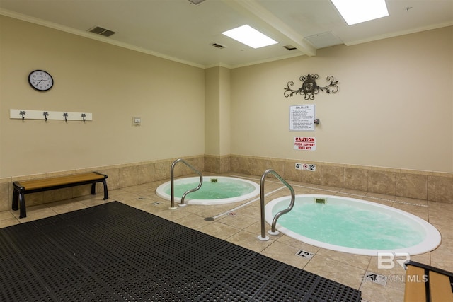 view of pool with an indoor hot tub