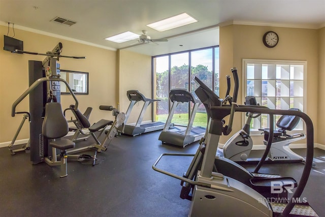 exercise room featuring ceiling fan and crown molding