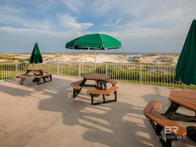 view of patio with a water view