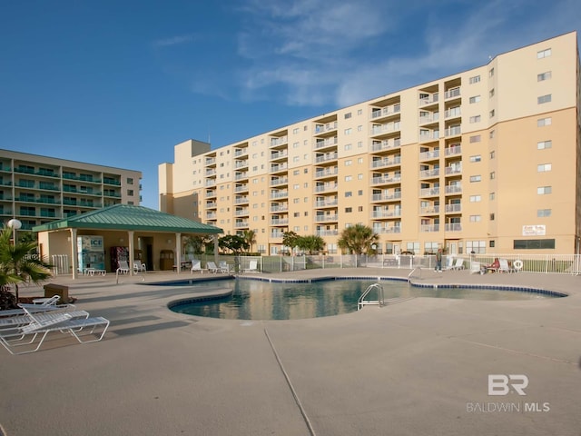 view of swimming pool featuring a patio area