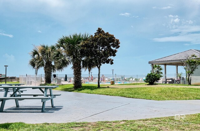 view of property's community with a yard